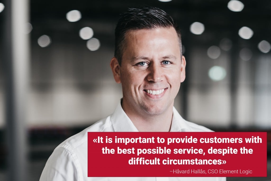 Portrait of Håvard Hallås, CSO in Element Logic in front of AutoStore grid. 