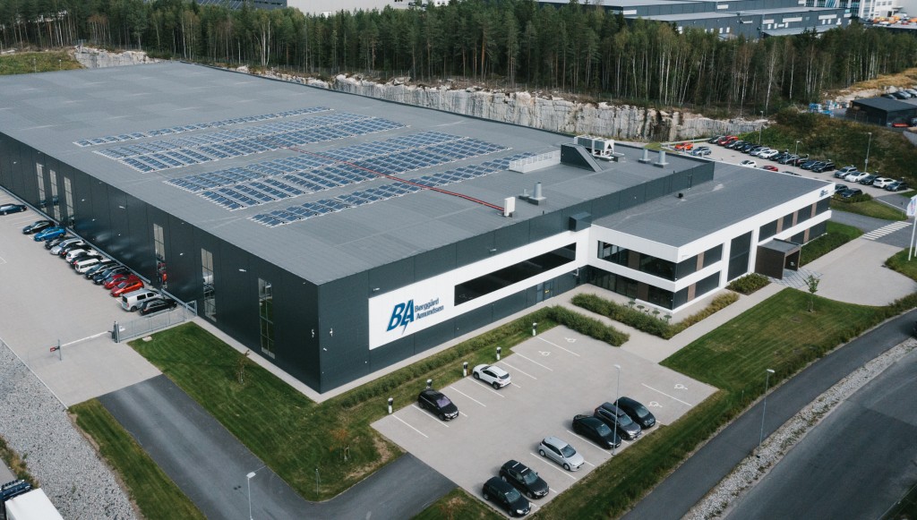 Drone over warehouse with solar panels on the roof