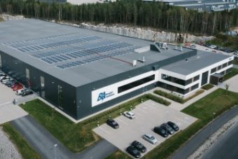 Drone over warehouse with solar panels on the roof