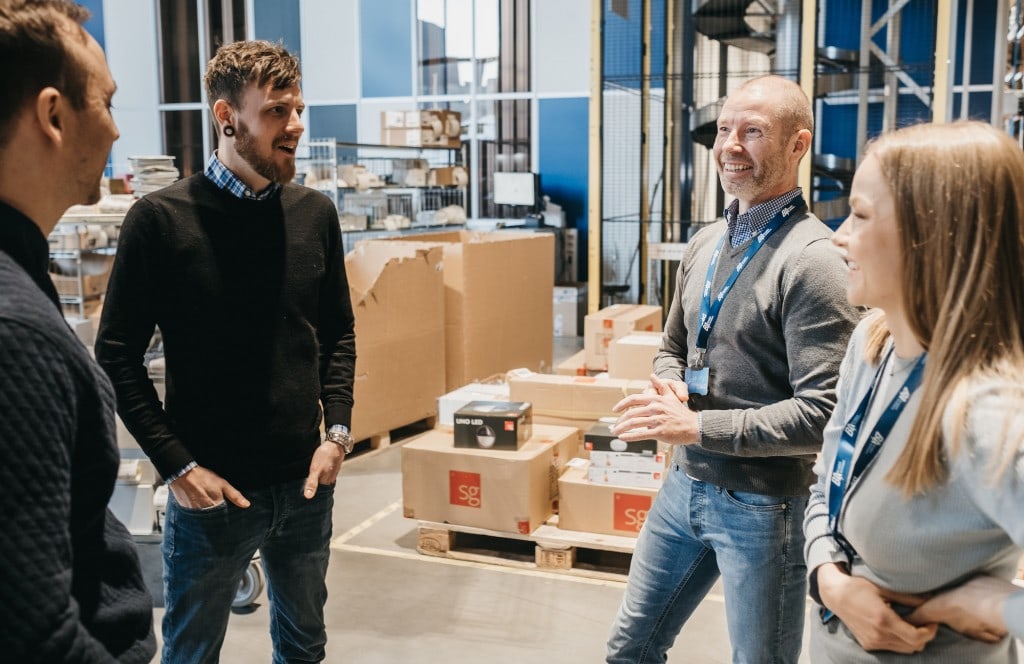 Berggaard Amundsen employees talking to Element Logic employees inside warehouse