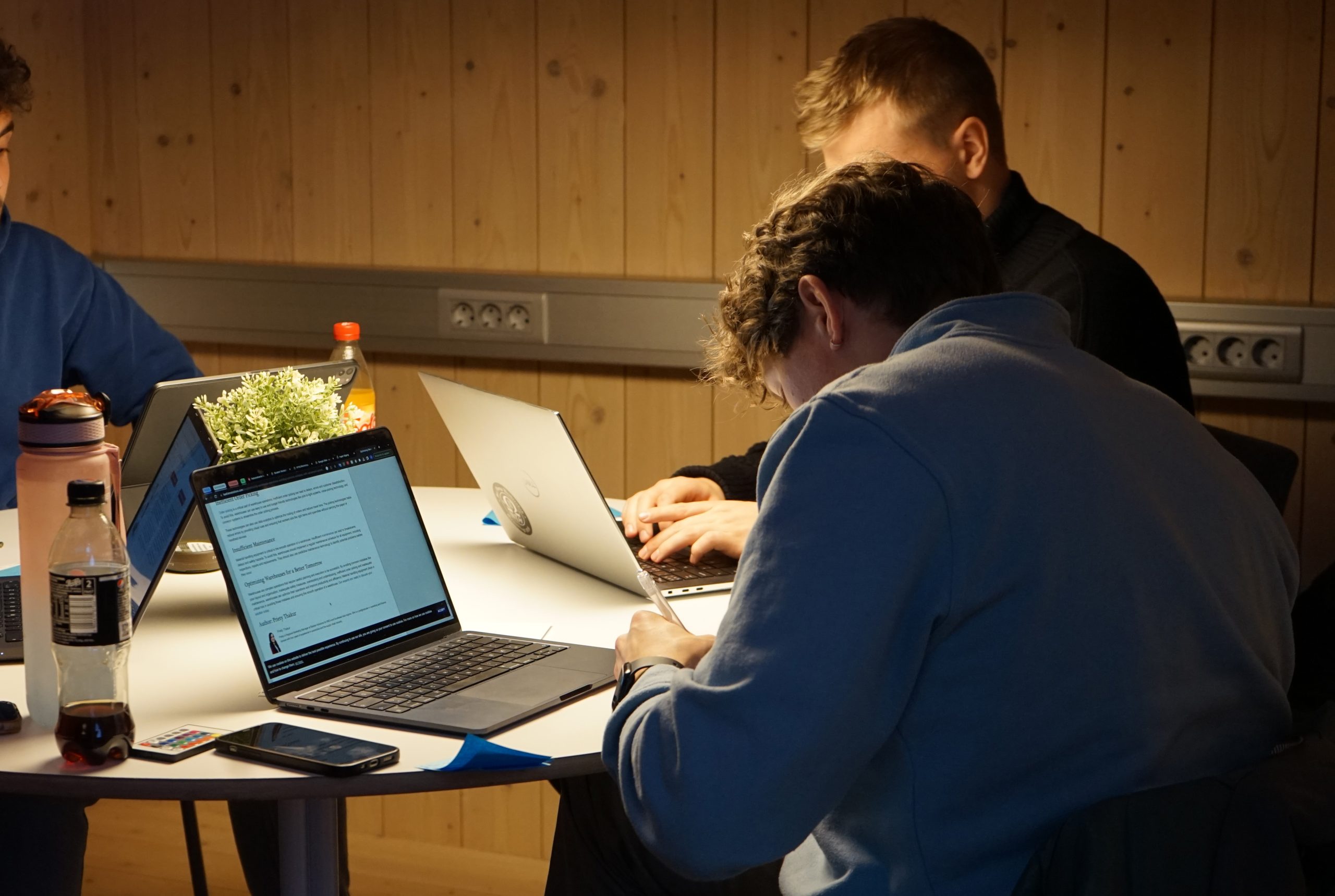 Three students working with their case